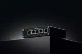 Teltonika TSW100 – вид Ethernet-портов на чёрном фоне